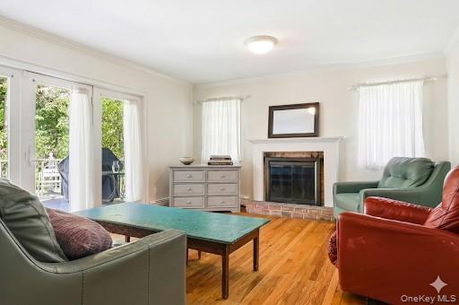 9 Townsend Road Glen Cove, NY 11542 - Photo 23 of 48 a living room with furniture and a fireplace