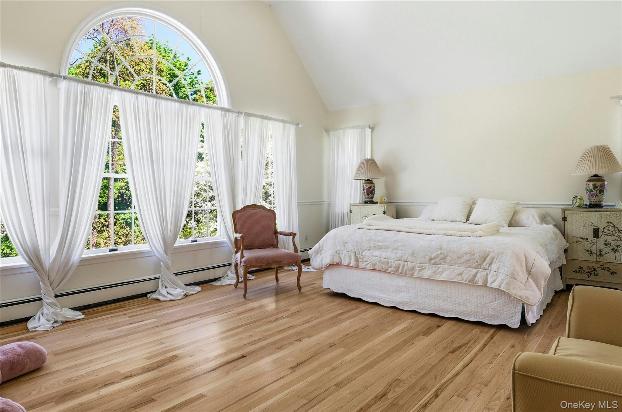 9 Townsend Road Glen Cove, NY 11542 - Photo 27 of 48 a bedroom with a bed and a chair