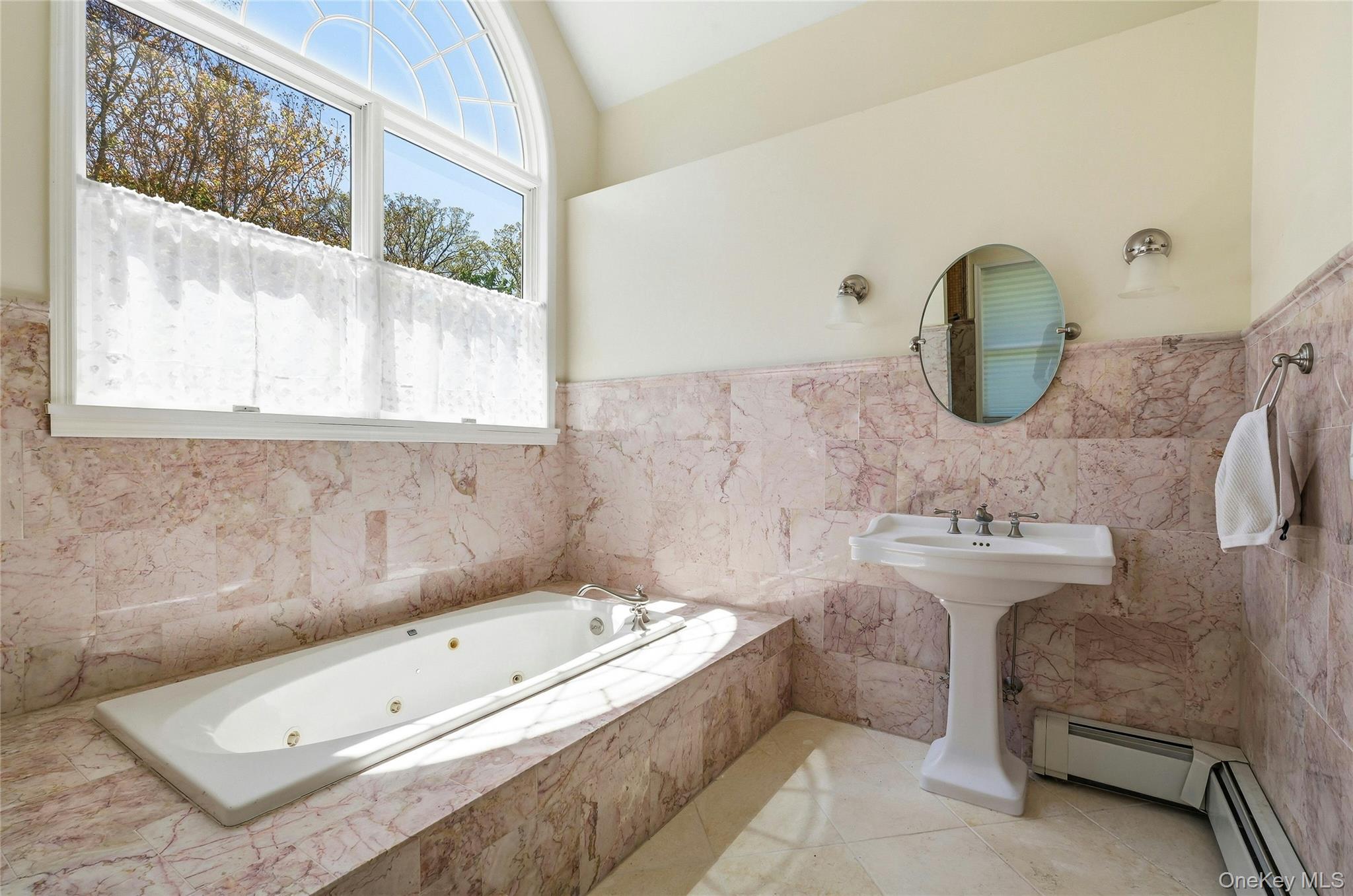 9 Townsend Road Glen Cove, NY 11542 - Photo 29 of 48 a bathroom with a tub a sink and a window