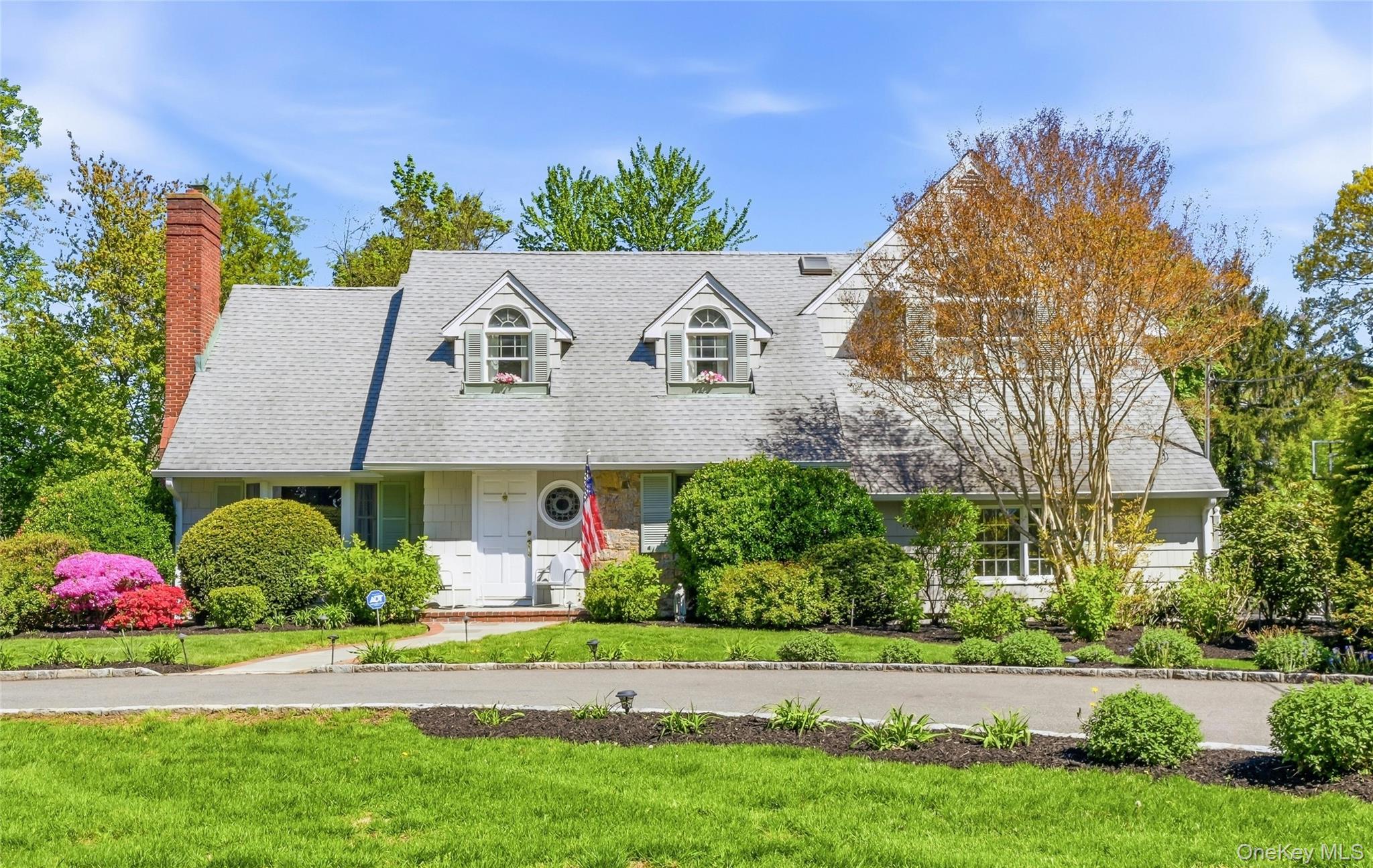 9 Townsend Road Glen Cove, NY 11542 - Photo 3 of 48 a front view of a house with a yard