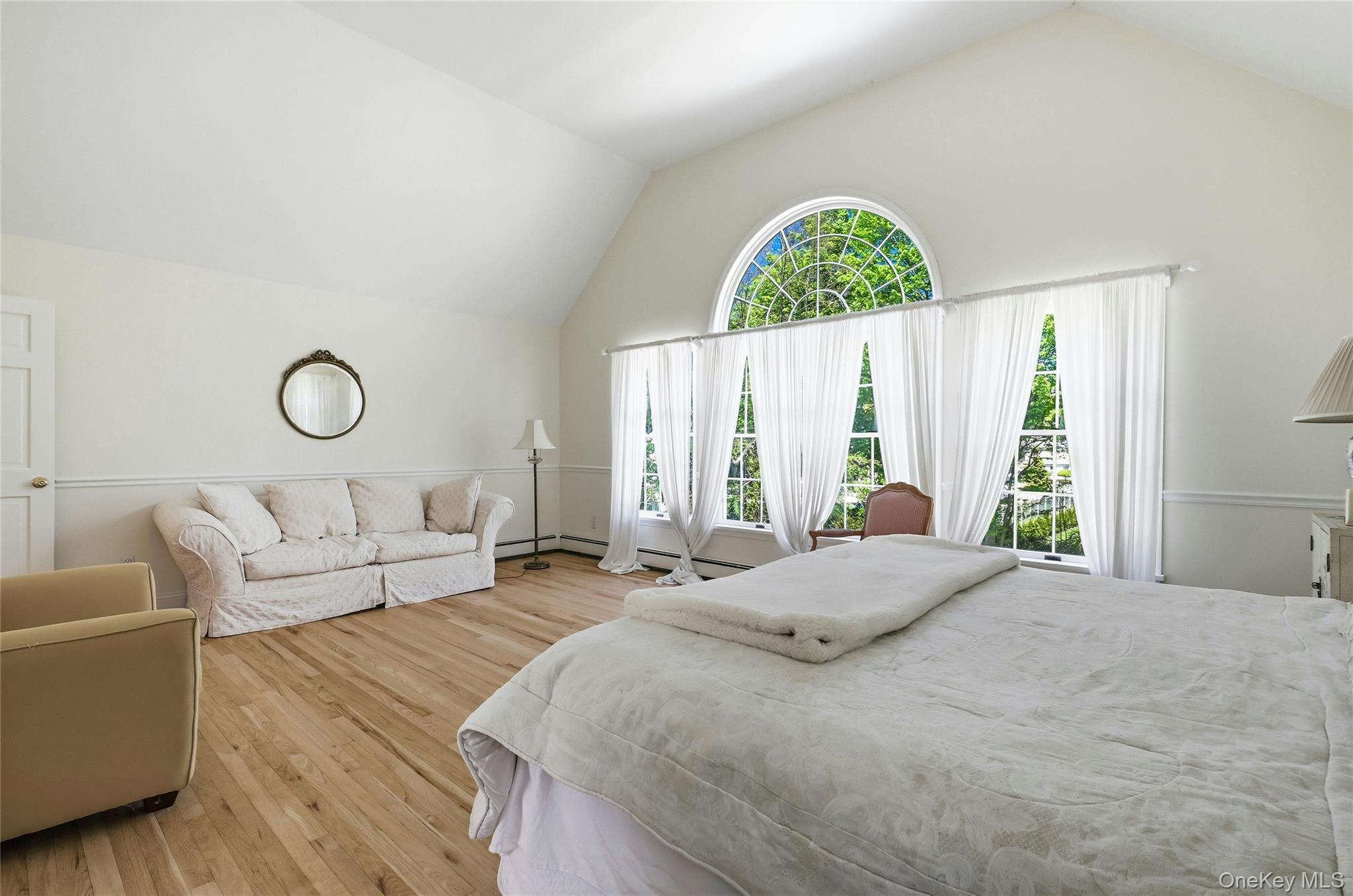 9 Townsend Road Glen Cove, NY 11542 - Photo 31 of 48 a bedroom with a large bed and a couch