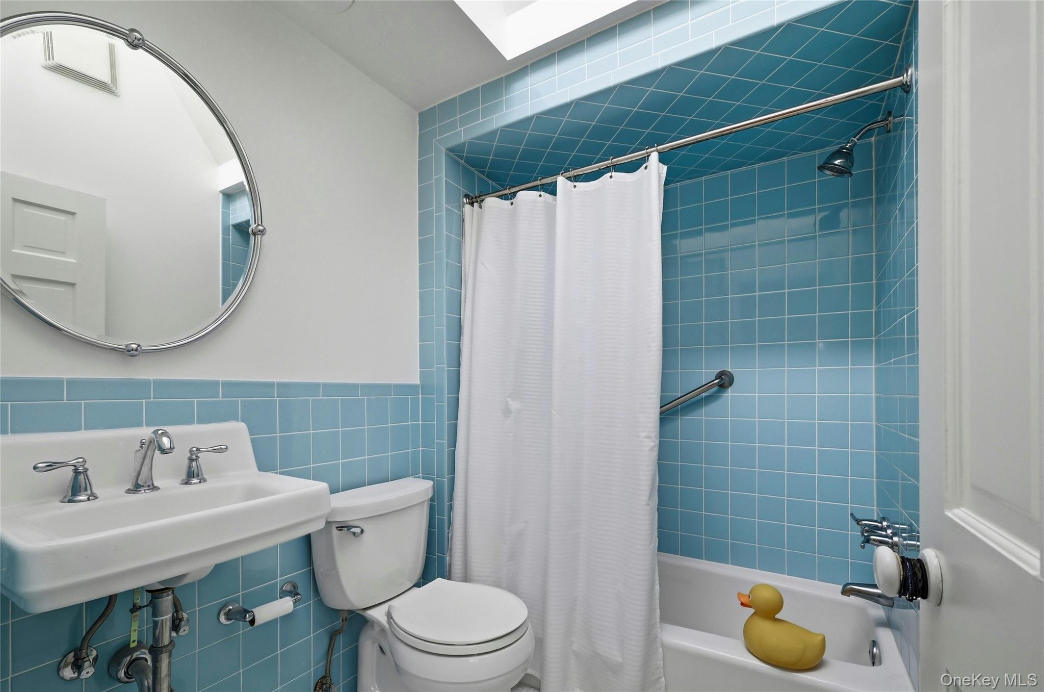 9 Townsend Road Glen Cove, NY 11542 - Photo 33 of 48 a bathroom with a sink and a mirror