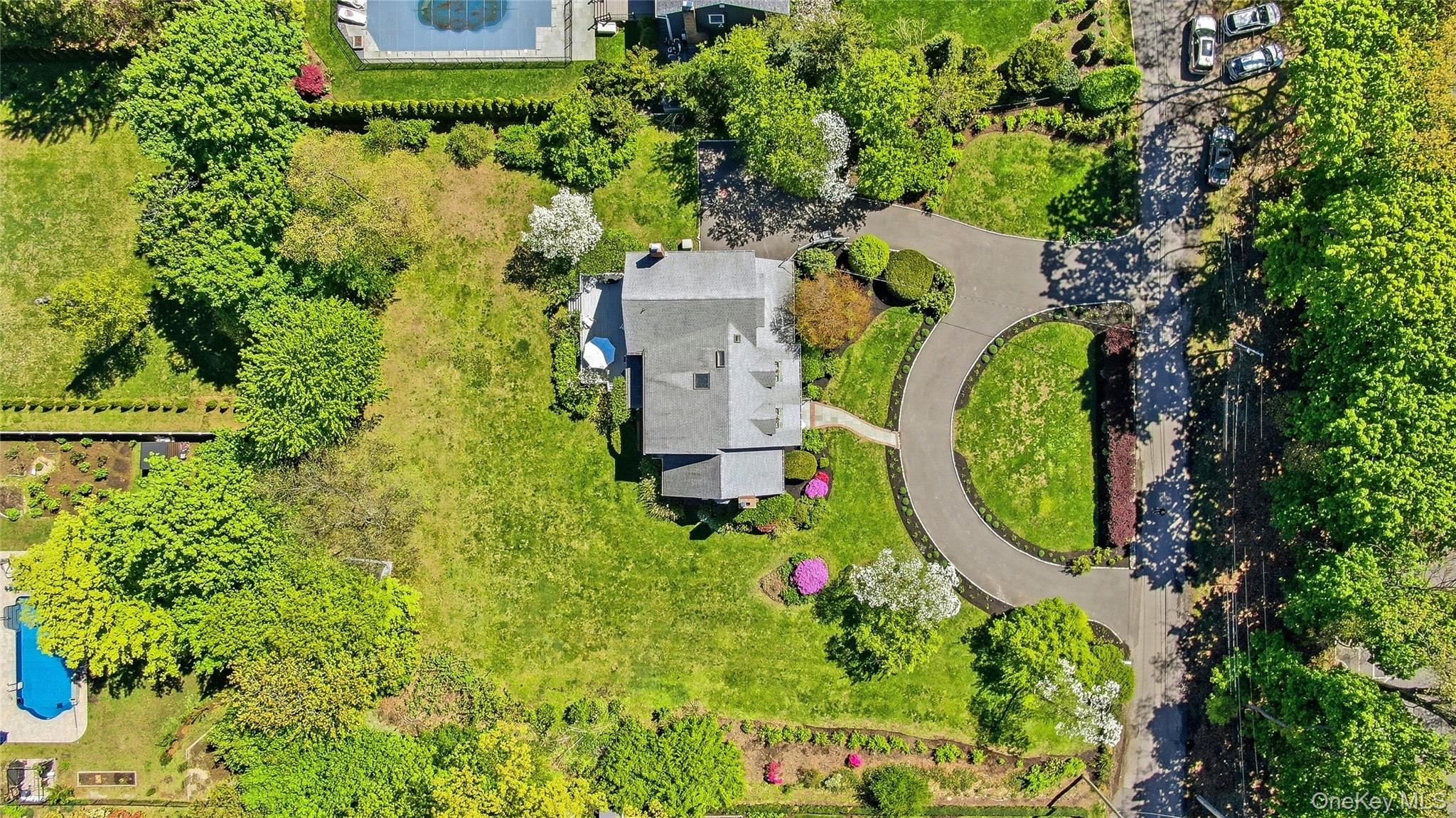 9 Townsend Road Glen Cove, NY 11542 - Photo 44 of 48 an aerial view of a house with swimming pool and garden