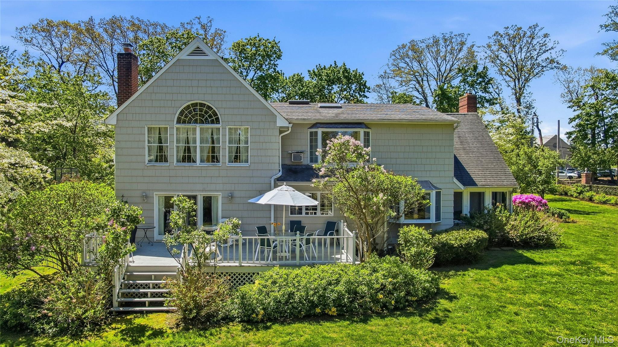 9 Townsend Road Glen Cove, NY 11542 - Photo 46 of 48 a front view of a house with a yard