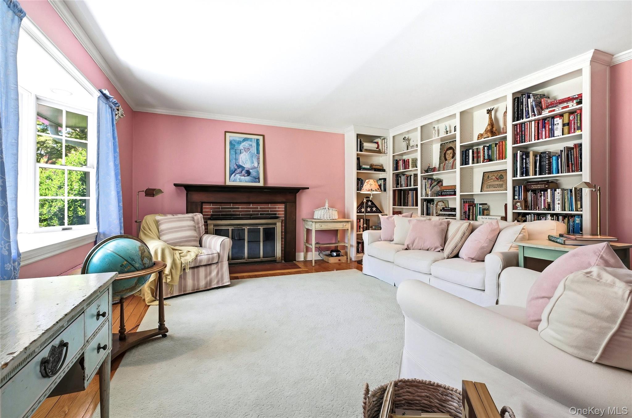 9 Townsend Road Glen Cove, NY 11542 - Photo 8 of 48 a living room with furniture a fireplace and a large window