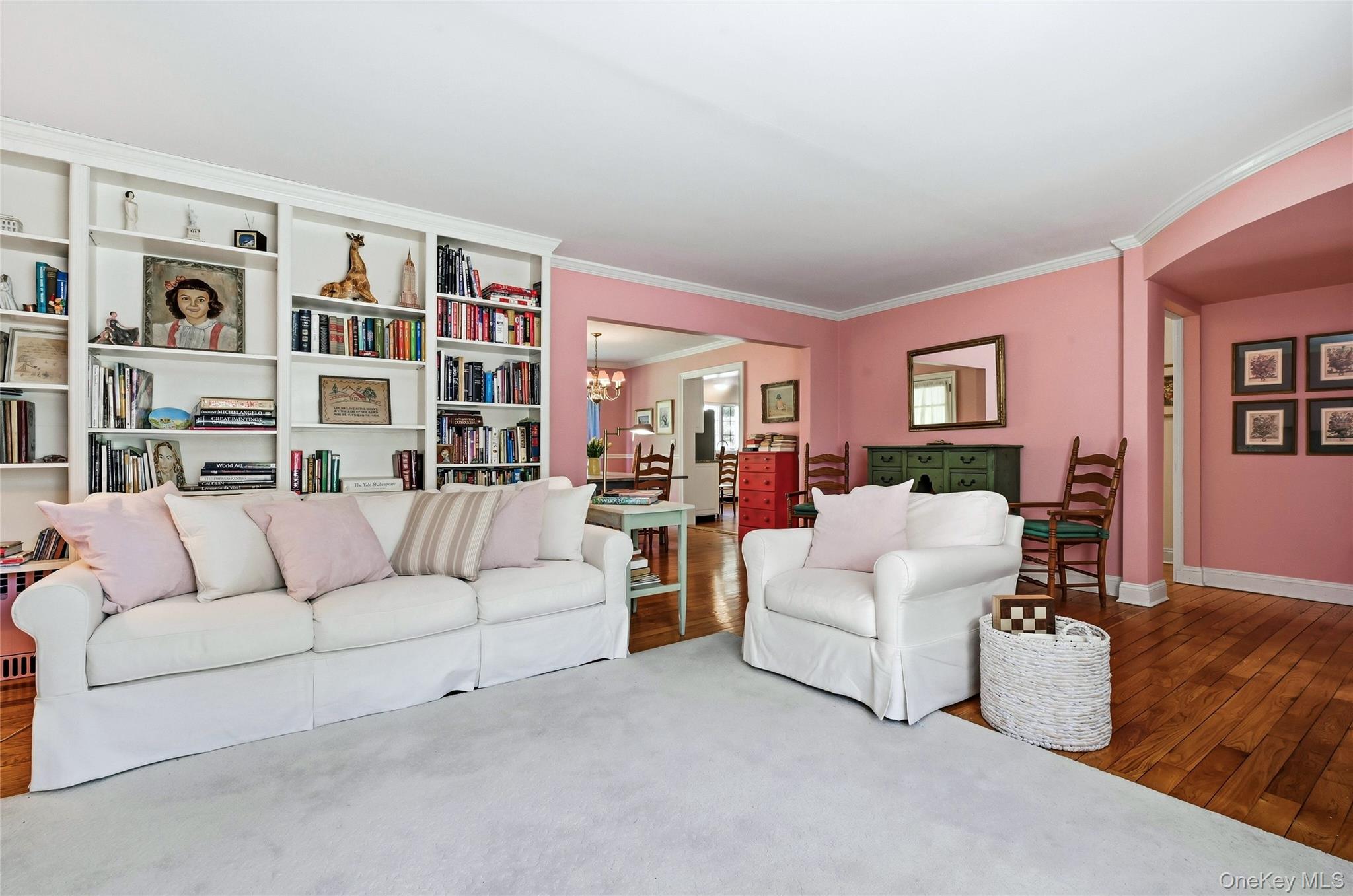 9 Townsend Road Glen Cove, NY 11542 - Photo 9 of 48 a living room with furniture and a book shelf