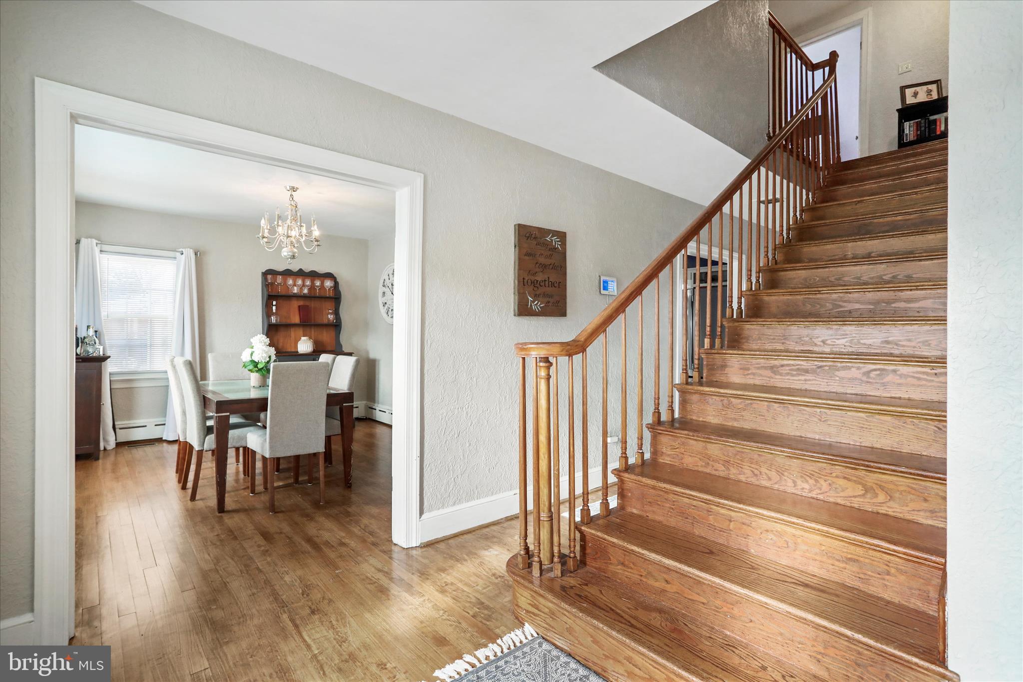425 West 15th Street Front Royal, VA 22630 - Photo 20 of 47 a view of a hallway with wooden floor table and chairs