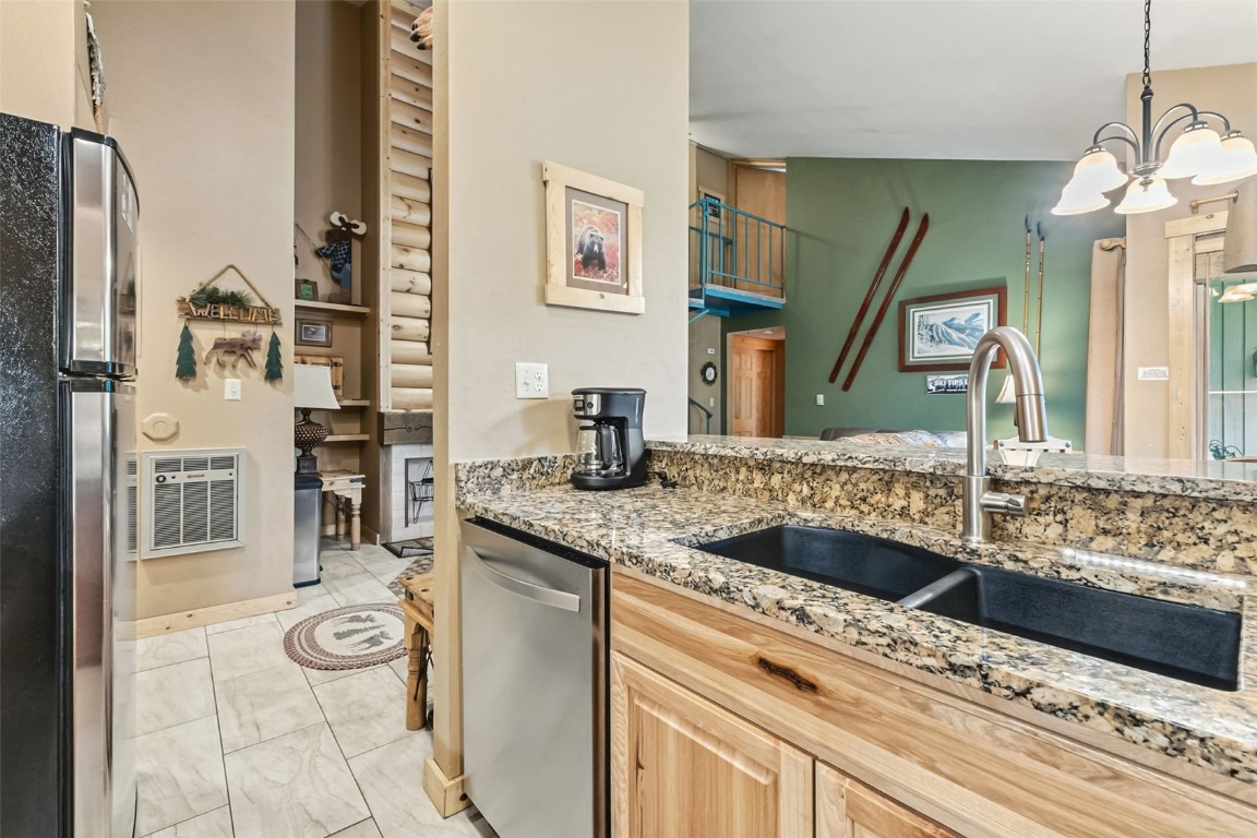 1937 Soda Ridge Road, Unit 1126 Keystone, CO 80435 - Photo 11 of 41 a bathroom with a granite countertop sink and a mirror