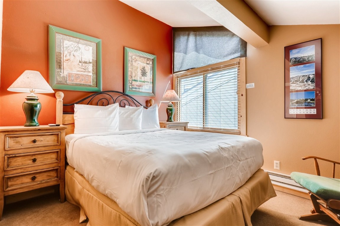 1937 Soda Ridge Road, Unit 1126 Keystone, CO 80435 - Photo 20 of 41 a bedroom with a bed and a window