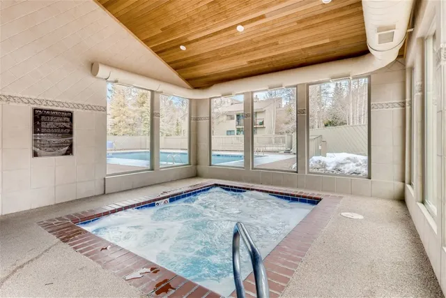 a view of an empty room with windows