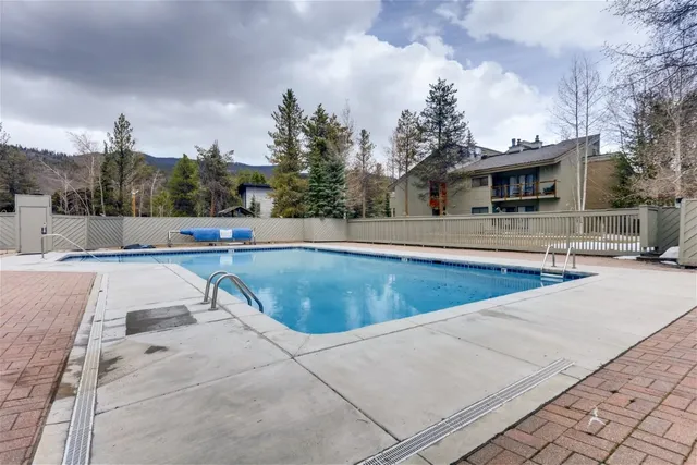 a view of a swimming pool with a patio