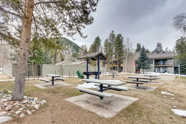 a view of a park with swings and slides