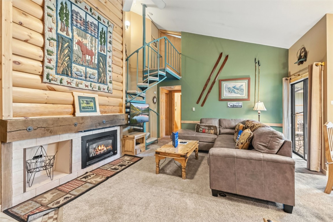 1937 Soda Ridge Road, Unit 1126 Keystone, CO 80435 - Photo 6 of 41 a living room with furniture a fireplace and a flat screen tv