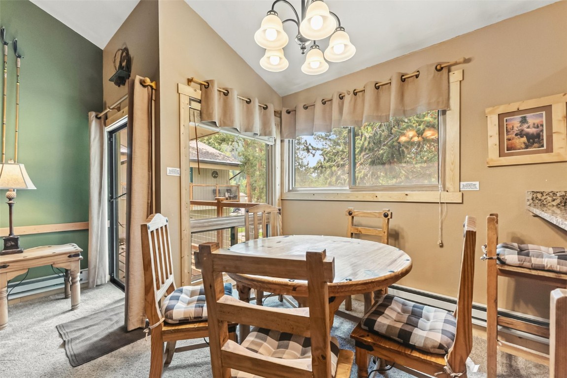 1937 Soda Ridge Road, Unit 1126 Keystone, CO 80435 - Photo 7 of 41 a view of a dining room with furniture window and outside view