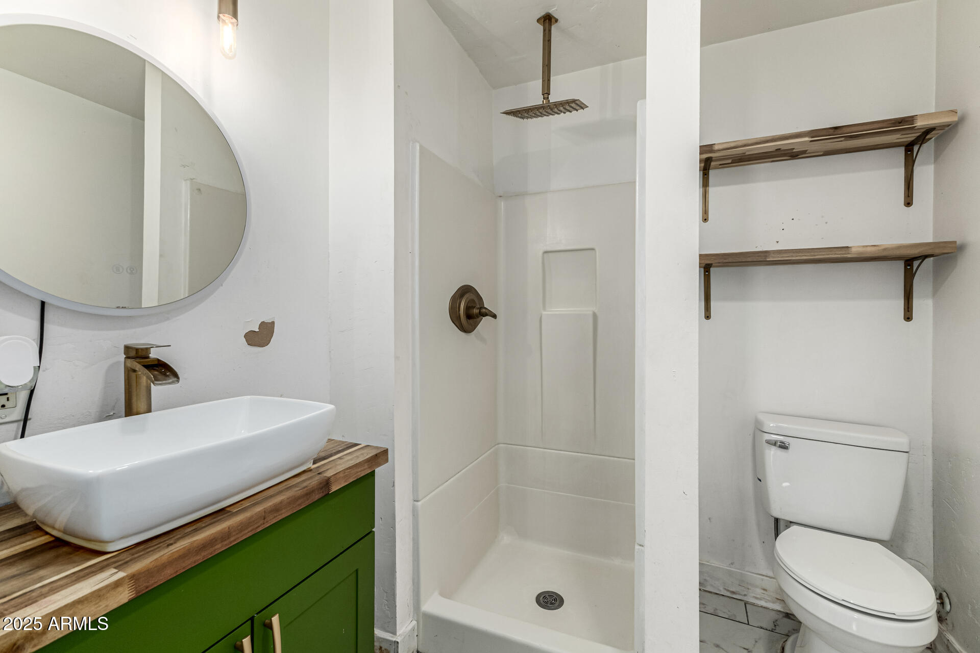 2811 West Pima Street Phoenix, AZ 85009 - Photo 16 of 24 a bathroom with a sink a toilet and shower