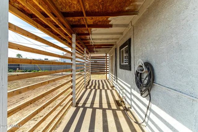 a view of balcony with wooden floor