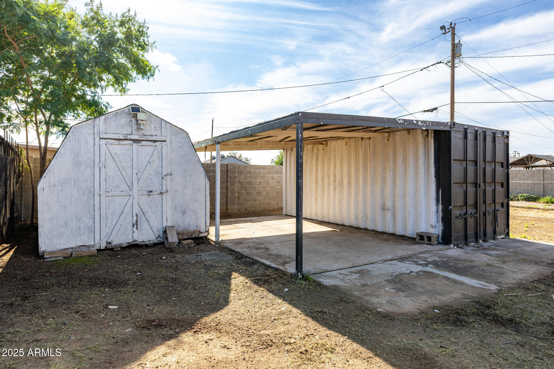 2811 West Pima Street Phoenix, AZ 85009 - Photo 23 of 24 a backyard of a house with a table and chairs
