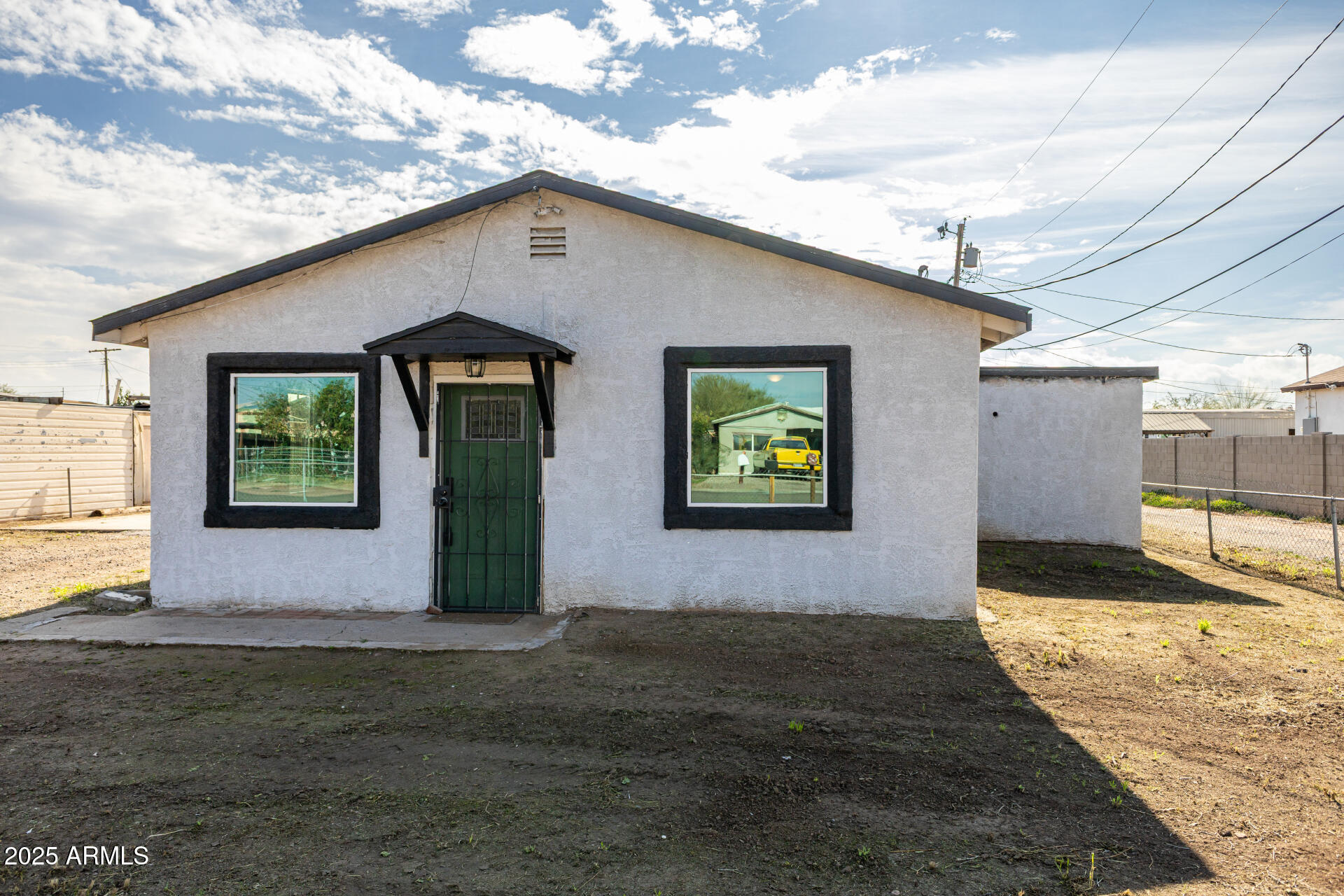 2811 West Pima Street Phoenix, AZ 85009 - Photo 3 of 24 a front view of a house with garden