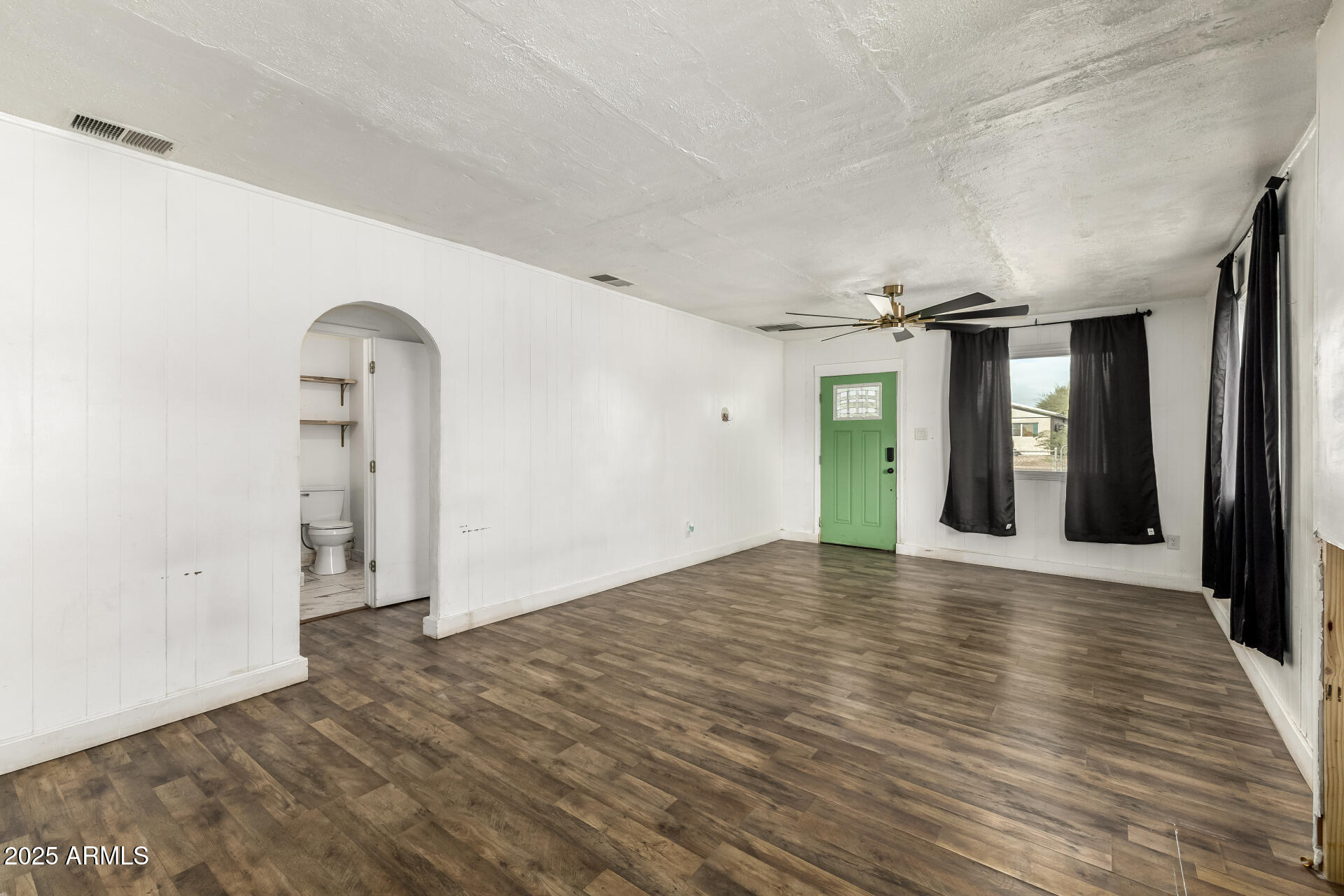 2811 West Pima Street Phoenix, AZ 85009 - Photo 5 of 24 a view of empty room with wooden floor