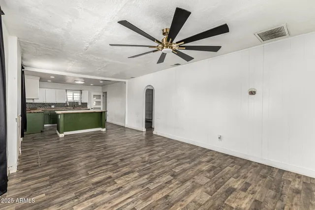 a view of a livingroom with a kitchen