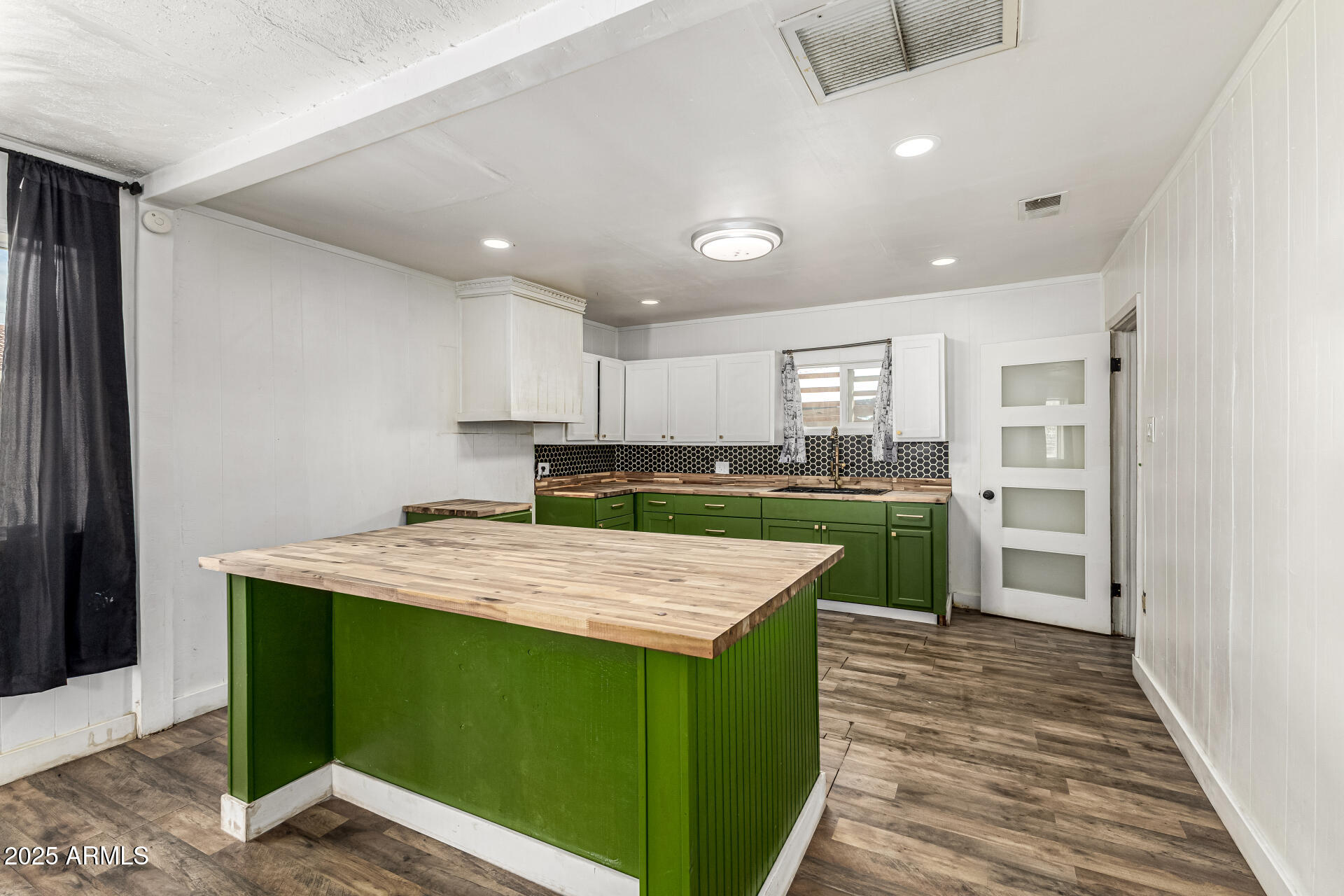 2811 West Pima Street Phoenix, AZ 85009 - Photo 9 of 24 a kitchen with a refrigerator and a sink