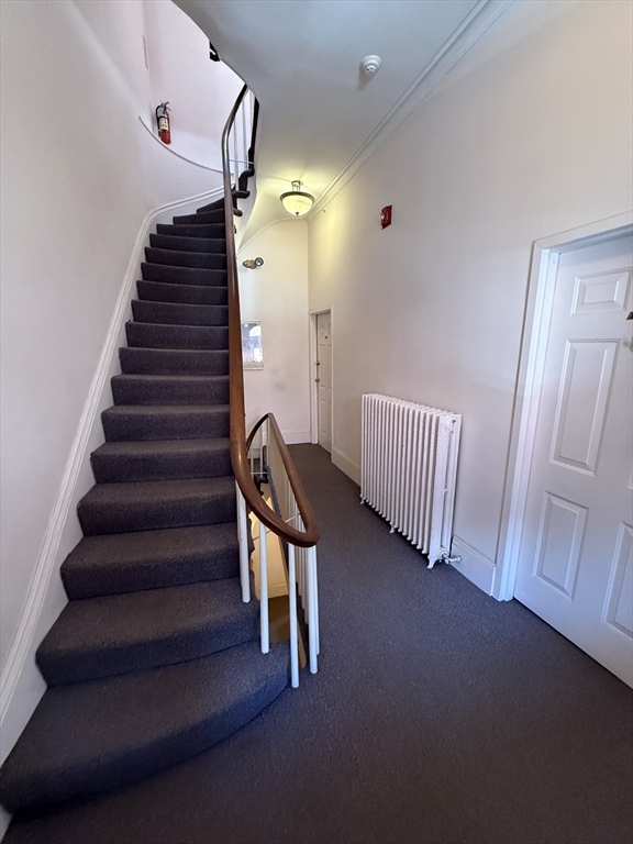 4 Milford Street, Unit M02 Boston, MA 02118 - Photo 9 of 9 a view of staircase with white walls
