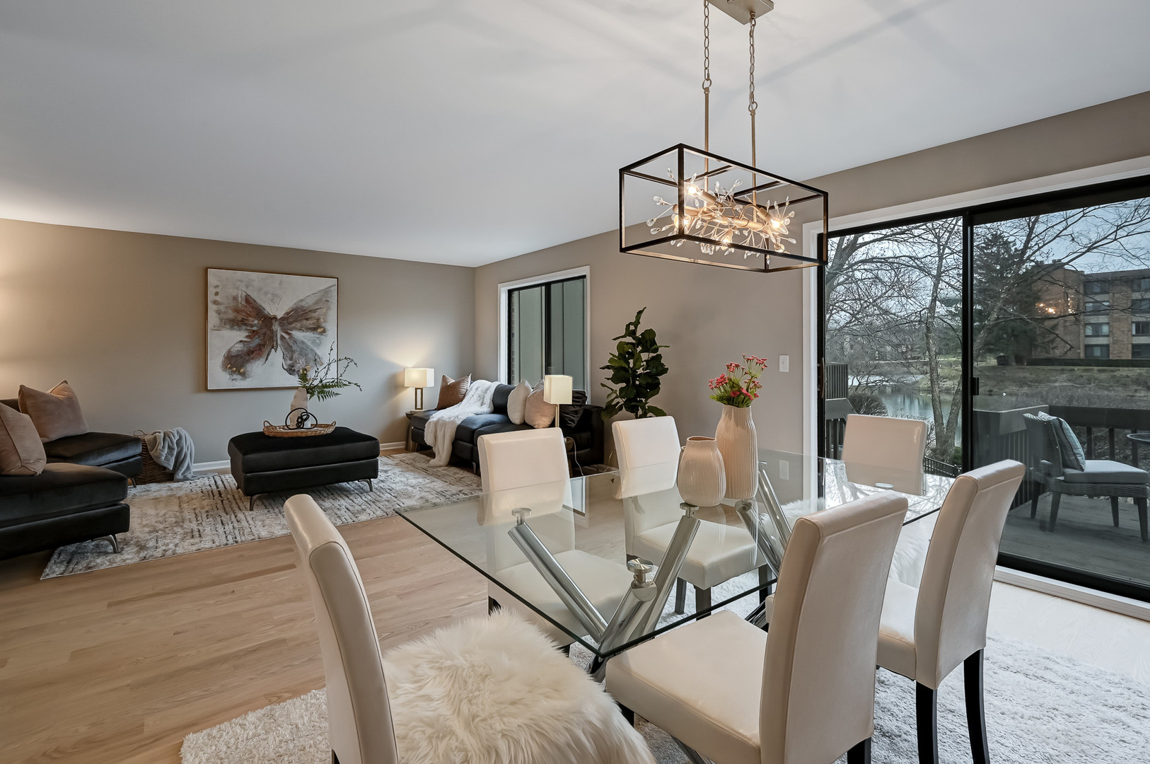 27 Windward Circle Willowbrook, IL 60527 - Photo 8 of 35 a living room with furniture a chandelier and a dining table