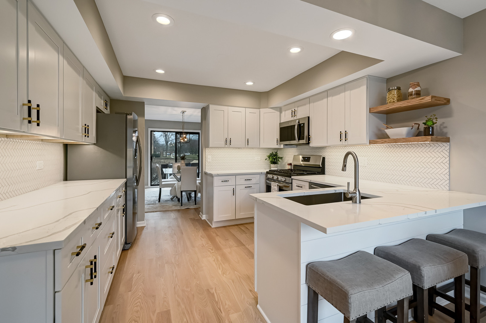 27 Windward Circle Willowbrook, IL 60527 - Photo 9 of 35 a kitchen with stainless steel appliances granite countertop a stove top oven a sink dishwasher and a refrigerator with wooden floor