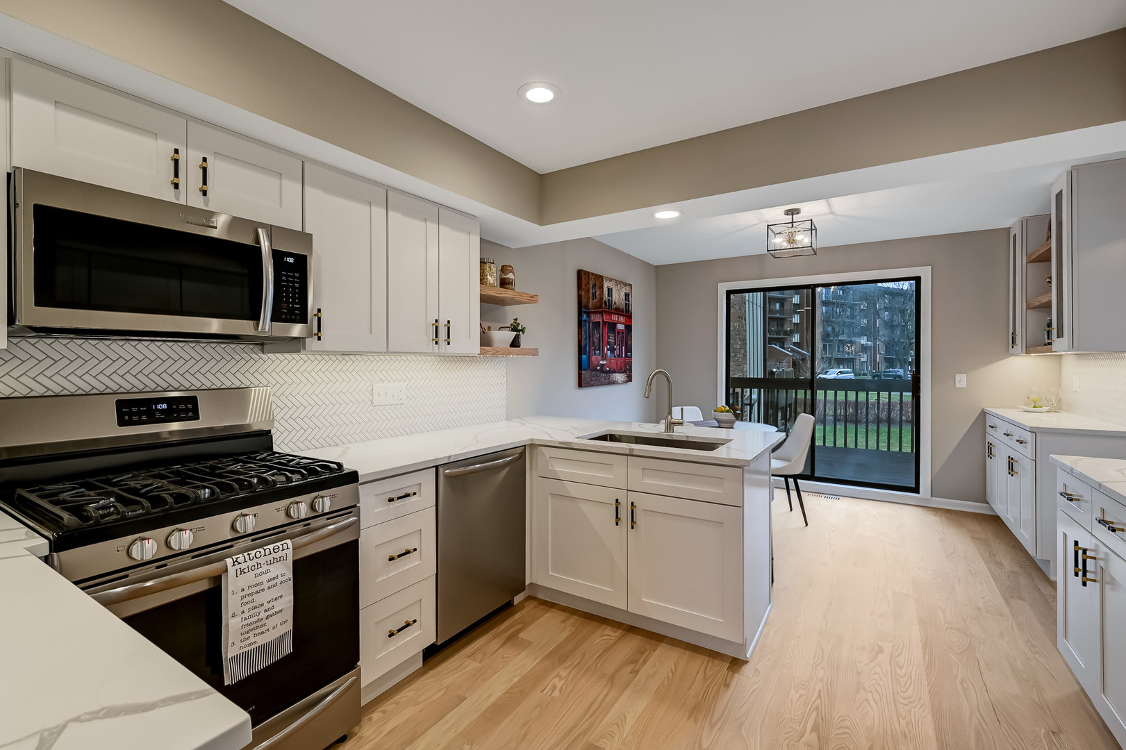 27 Windward Circle Willowbrook, IL 60527 - Photo 10 of 35 a kitchen with stainless steel appliances a stove sink microwave and cabinets