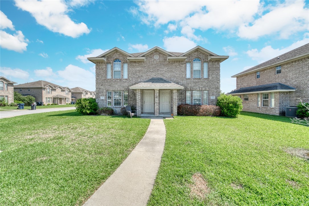 2327 Autumn Chase Loop College Station, TX 77840 - Photo 1 of 12 a front view of house with yard and green space