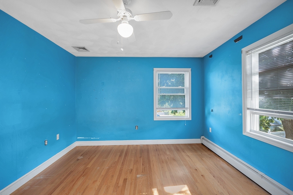 7 Marie Street Methuen, MA 01844 - Photo 28 of 39 wooden floor in an empty room with a window