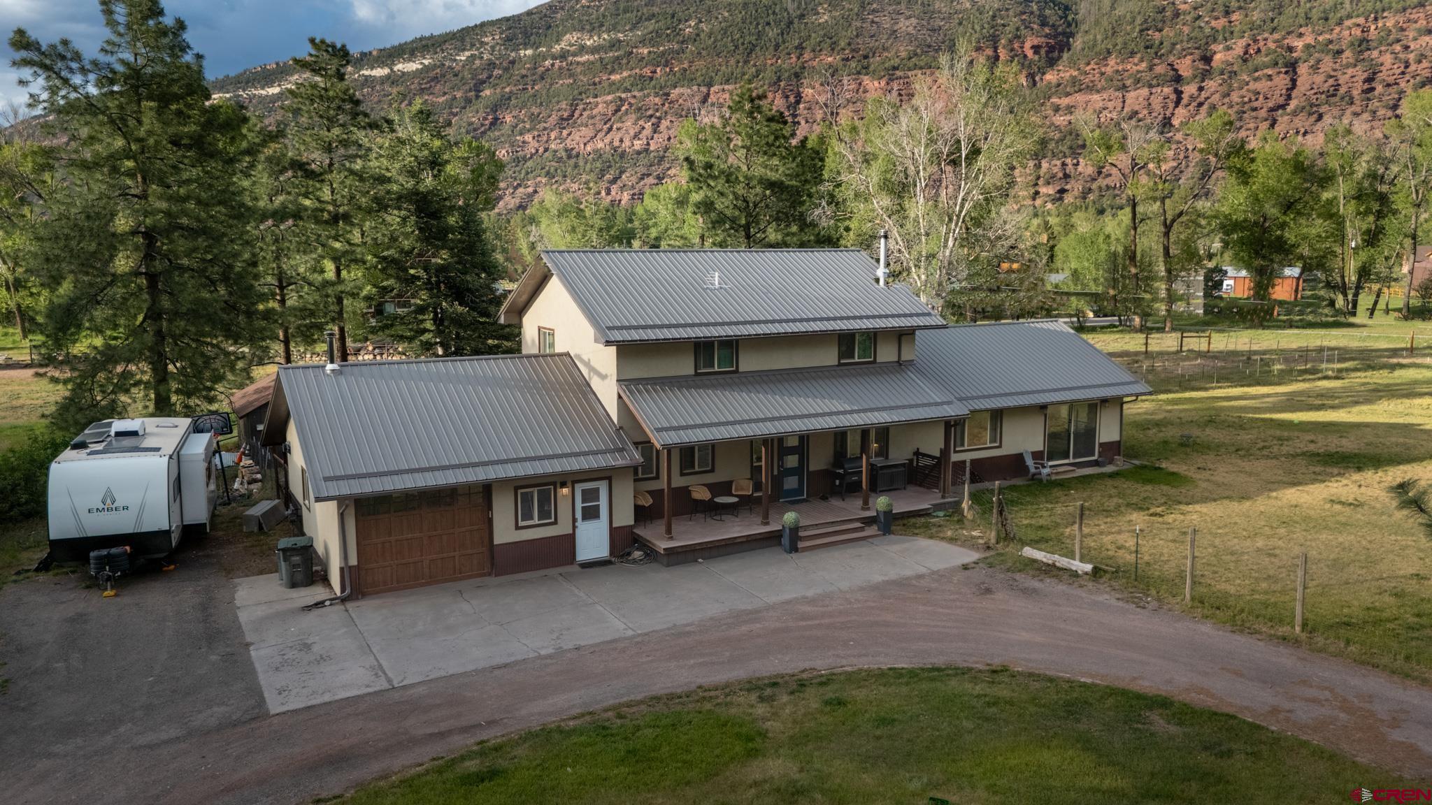 559 Suzanne Lane Ridgway, CO 81432 - Photo 38 of 45 an aerial view of a house with garden space and sitting area
