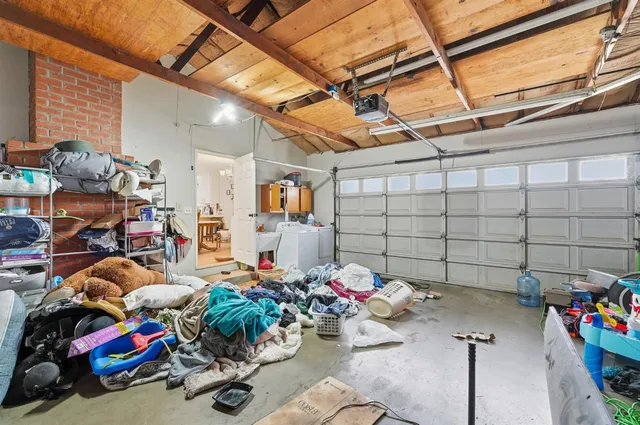 a view of a patio with table and chairs