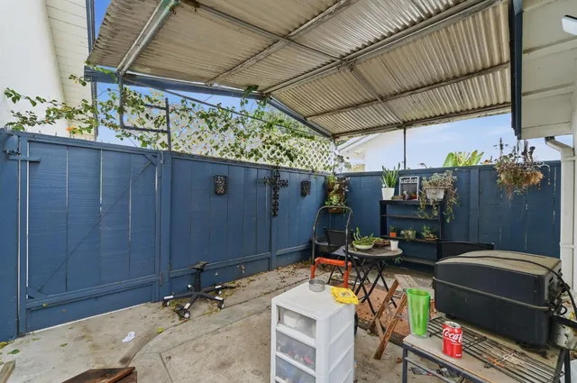 a view of a porch with seating space