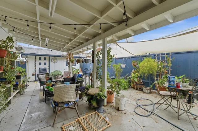 a view of an chairs and table in the balcony