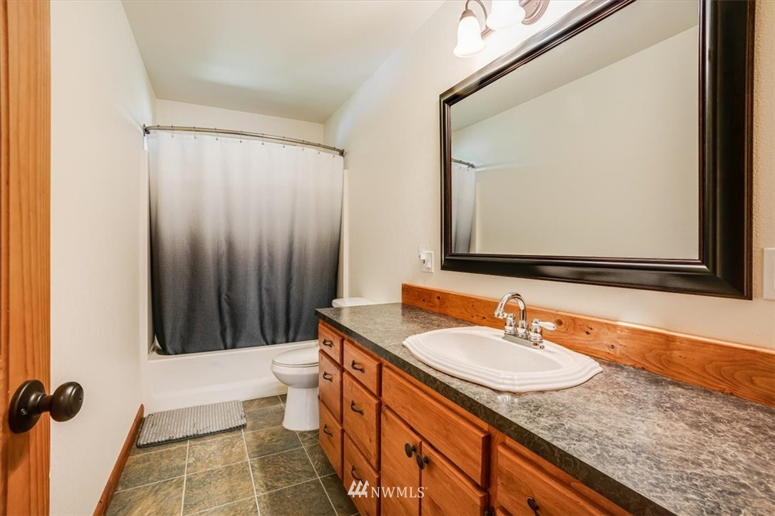 768 Leudinghaus Road Chehalis, WA 98532 - Photo 22 of 35 a bathroom with a granite countertop sink and a mirror