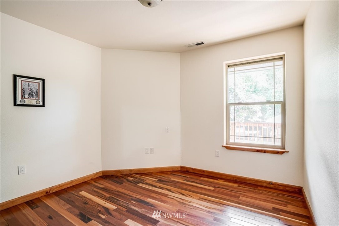 768 Leudinghaus Road Chehalis, WA 98532 - Photo 23 of 35 a view of an empty room with wooden floor and a window