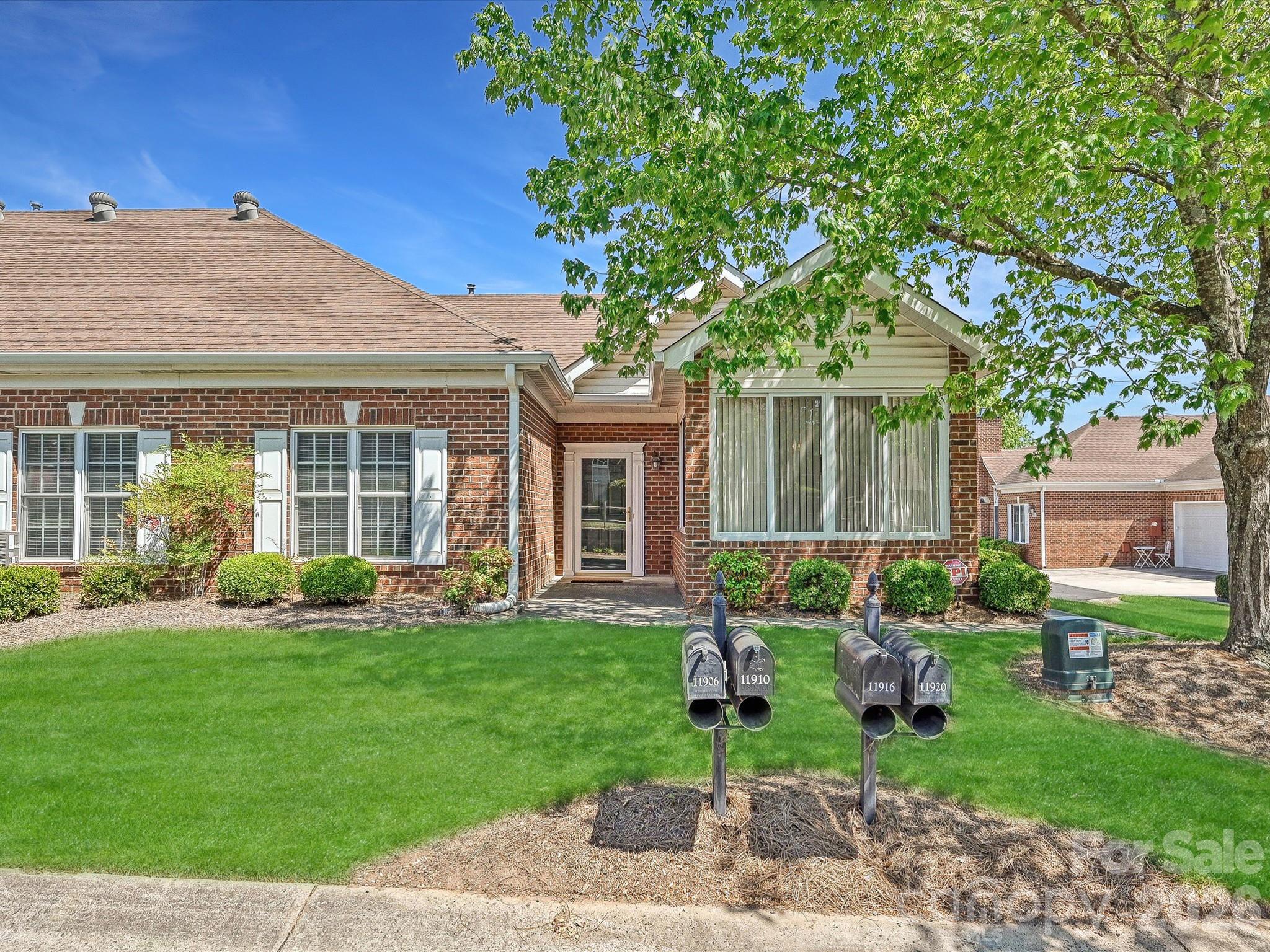 8655 Windsor Ridge Drive Charlotte, NC 28277 - Photo 1 of 22 front view of a house with a yard