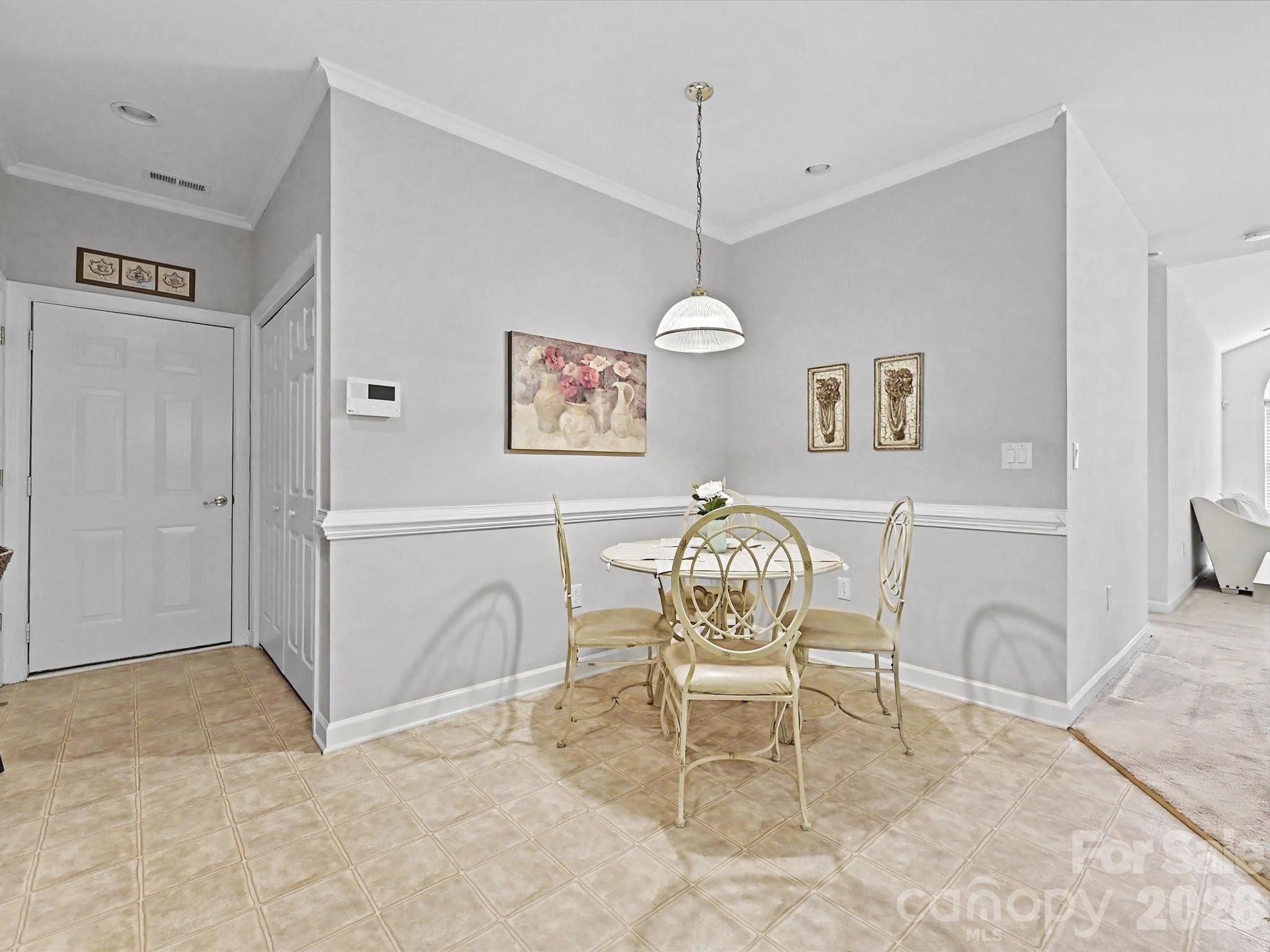 8655 Windsor Ridge Drive Charlotte, NC 28277 - Photo 11 of 22 a view of a dining room with furniture