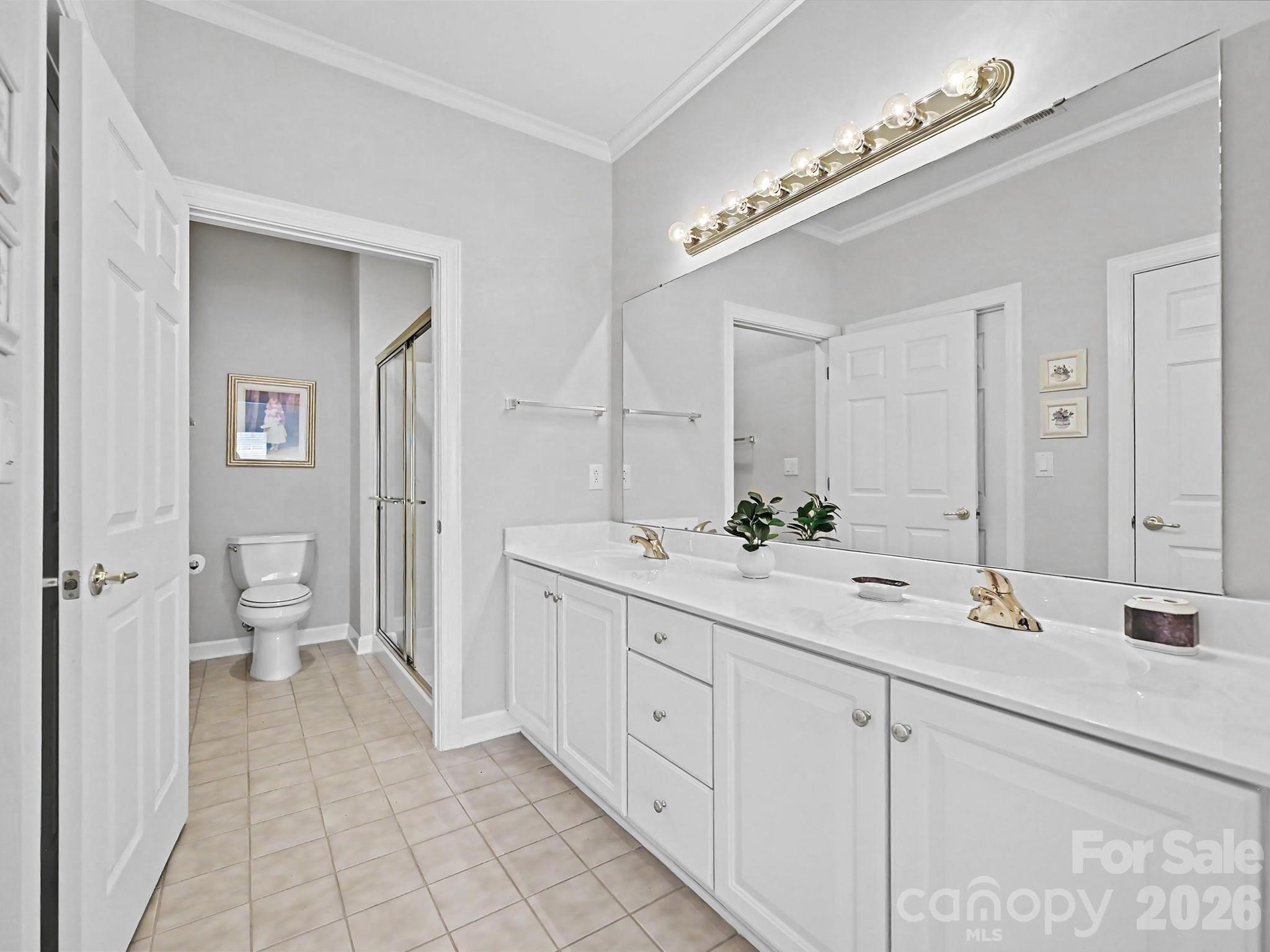8655 Windsor Ridge Drive Charlotte, NC 28277 - Photo 15 of 22 a spacious bathroom with a double vanity sink and a mirror