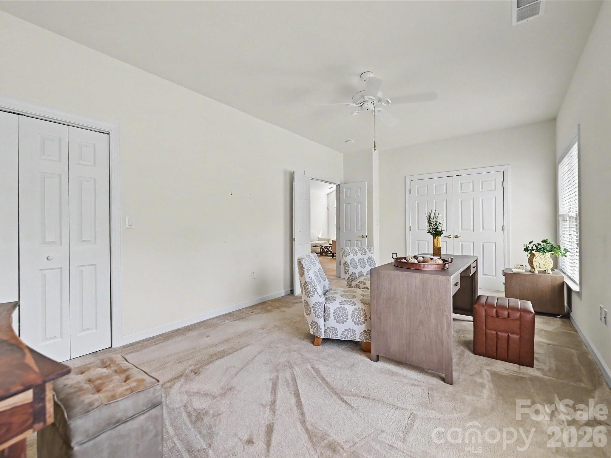 8655 Windsor Ridge Drive Charlotte, NC 28277 - Photo 16 of 22 a bedroom with furniture and a chandelier