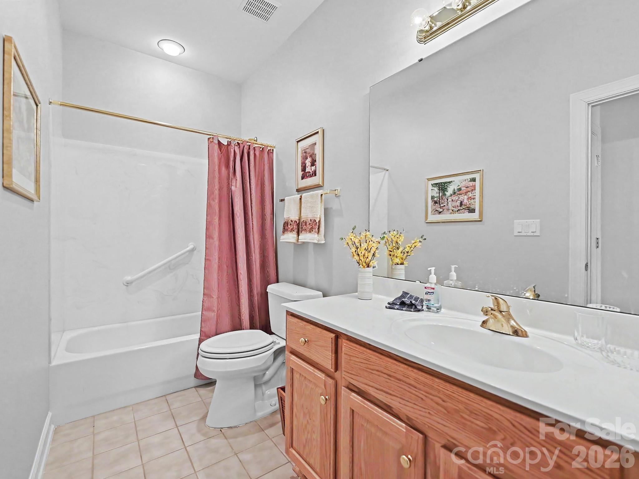8655 Windsor Ridge Drive Charlotte, NC 28277 - Photo 18 of 22 a bathroom with a sink a toilet and shower
