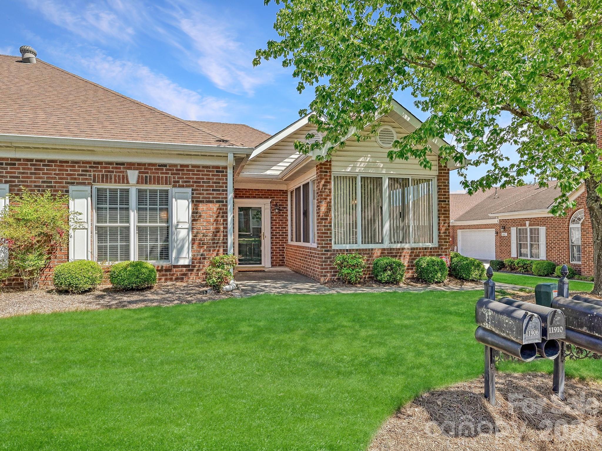 8655 Windsor Ridge Drive Charlotte, NC 28277 - Photo 22 of 22 a front view of a house with a yard and green space