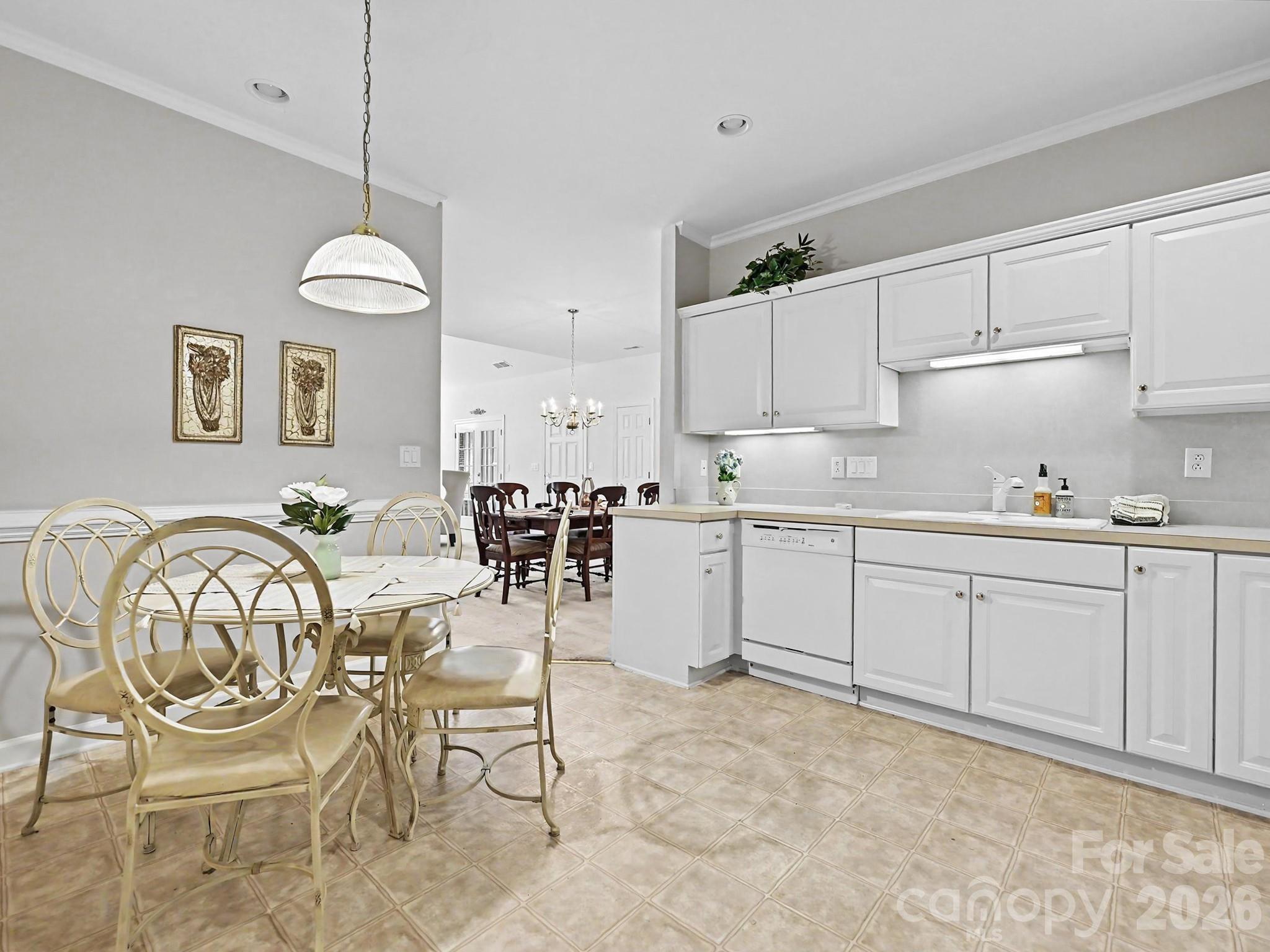 8655 Windsor Ridge Drive Charlotte, NC 28277 - Photo 10 of 22 a kitchen with cabinets and chairs in it