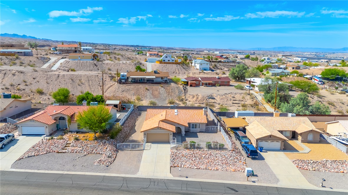2524 South Ridge Avenue Bullhead City, AZ 86429 - Photo 54 of 64 Aerial view of residential area featuring a mountain backdrop