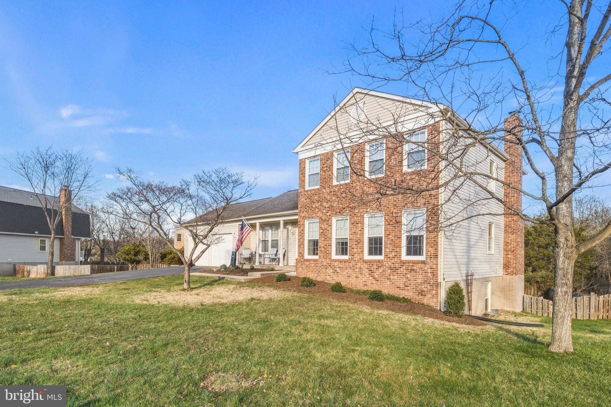 4357 Cub Run Road Chantilly, VA 20151 - Photo 1 of 40 a front view of a house with a yard