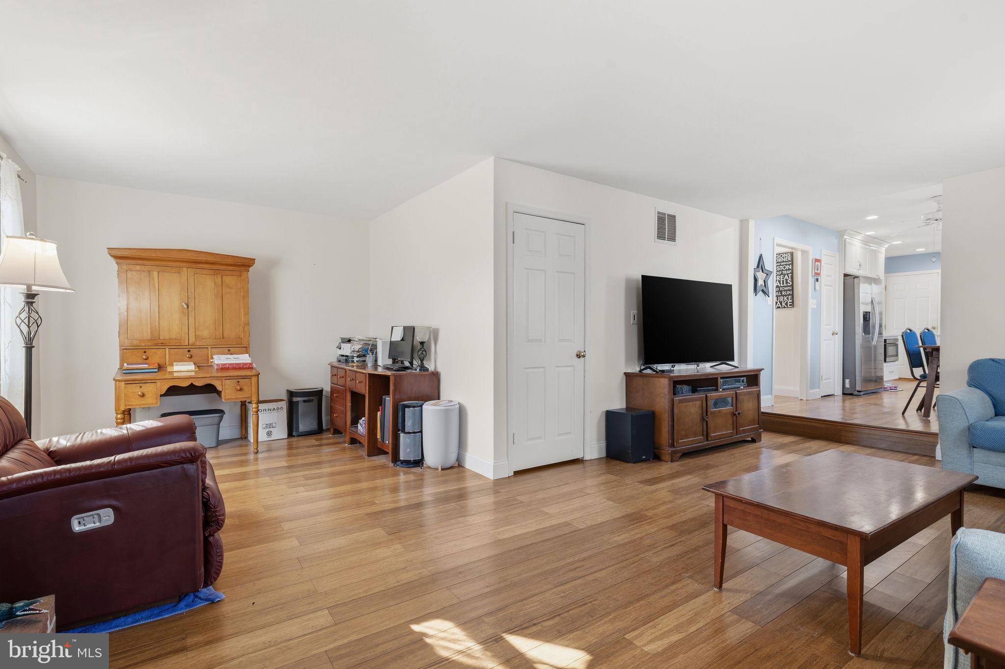 4357 Cub Run Road Chantilly, VA 20151 - Photo 12 of 40 a living room with furniture and a flat screen tv