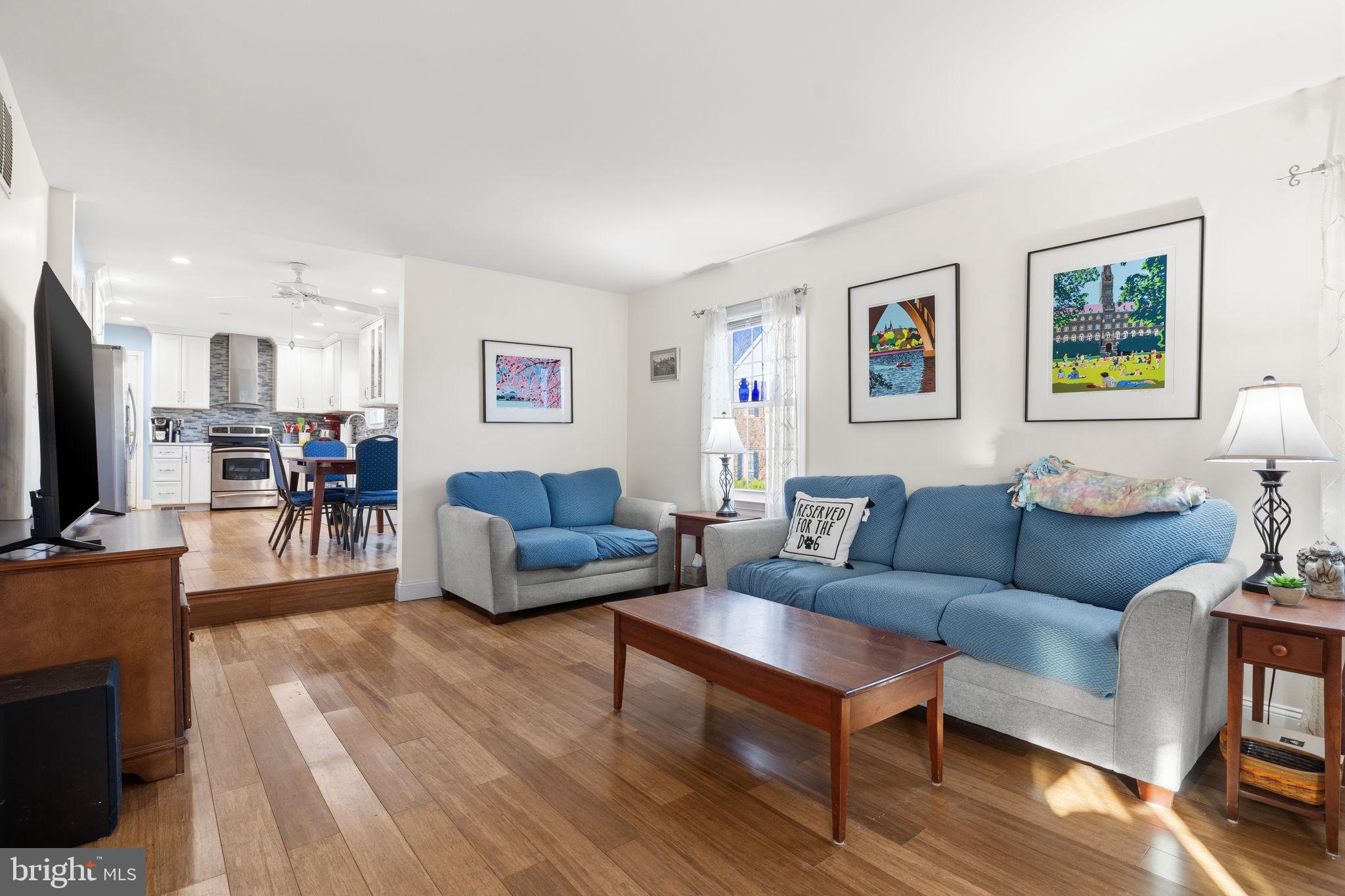 4357 Cub Run Road Chantilly, VA 20151 - Photo 13 of 40 a living room with furniture a flat screen tv and a table