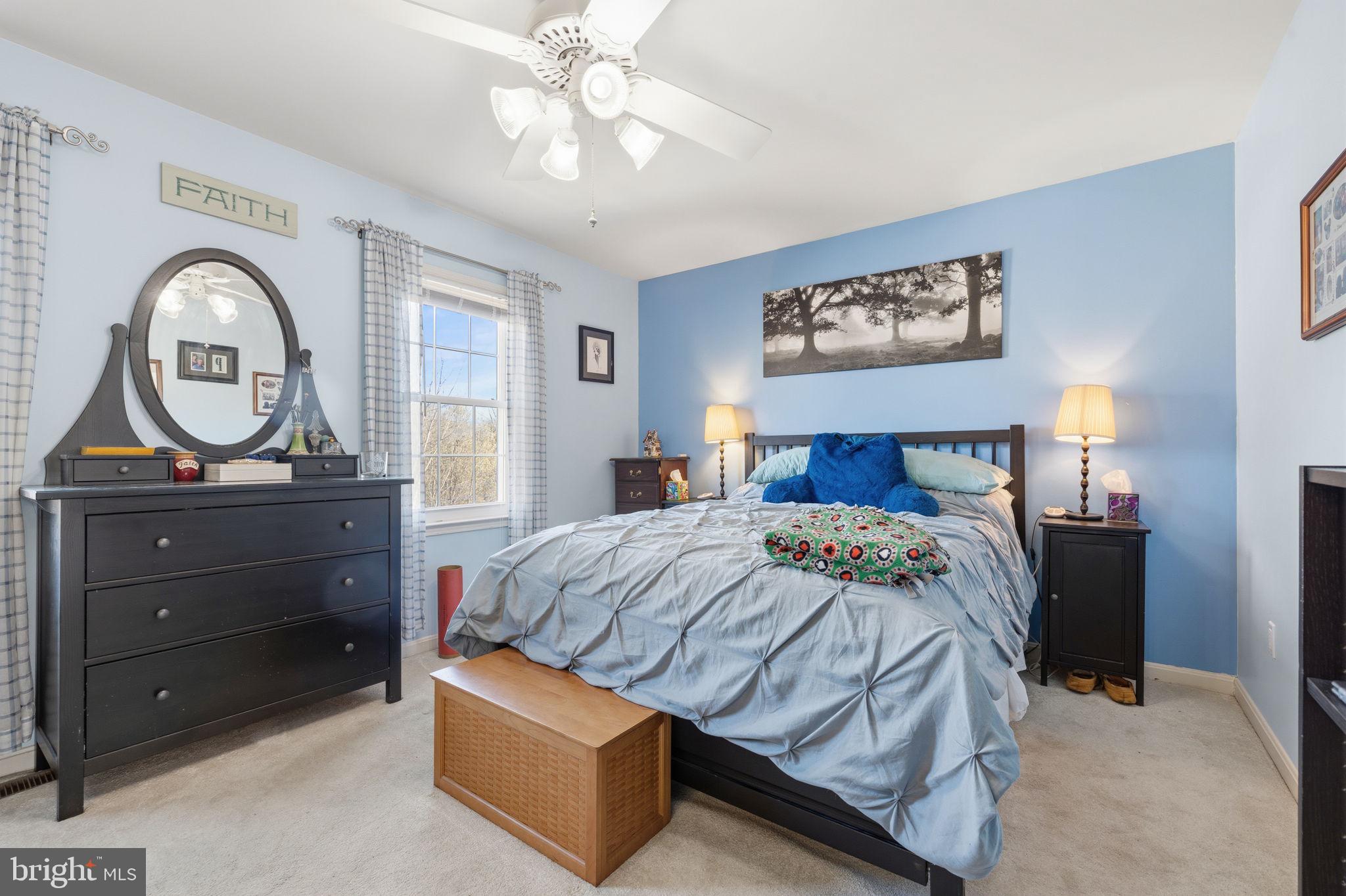 4357 Cub Run Road Chantilly, VA 20151 - Photo 17 of 40 a bedroom with a bed and a chandelier