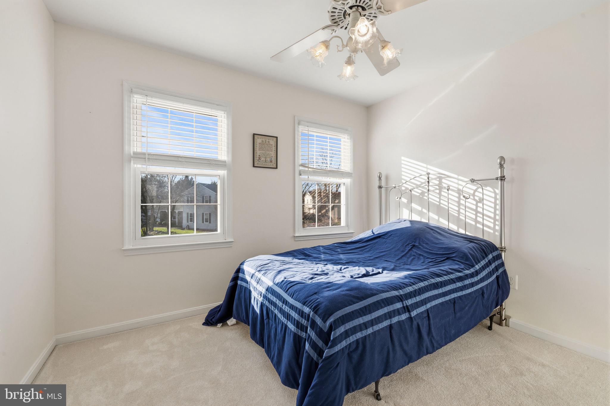 4357 Cub Run Road Chantilly, VA 20151 - Photo 21 of 40 a bed sitting in a bedroom next to a window and a chandelier